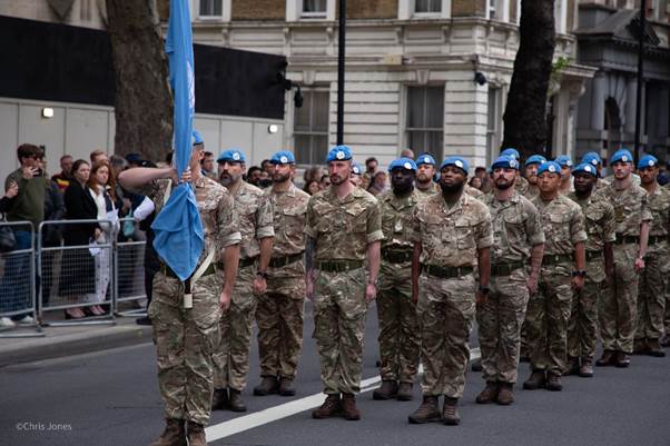 A group of soldiers marching in a parade  AI-generated content may be incorrect.